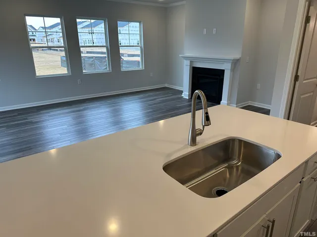 a kitchen with a sink and a window