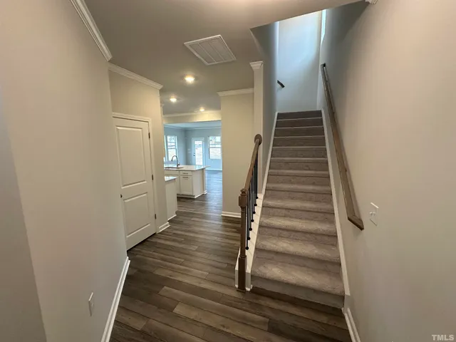 a view of hallway with windows