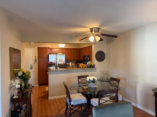 a view of a dining room with furniture and chandelier