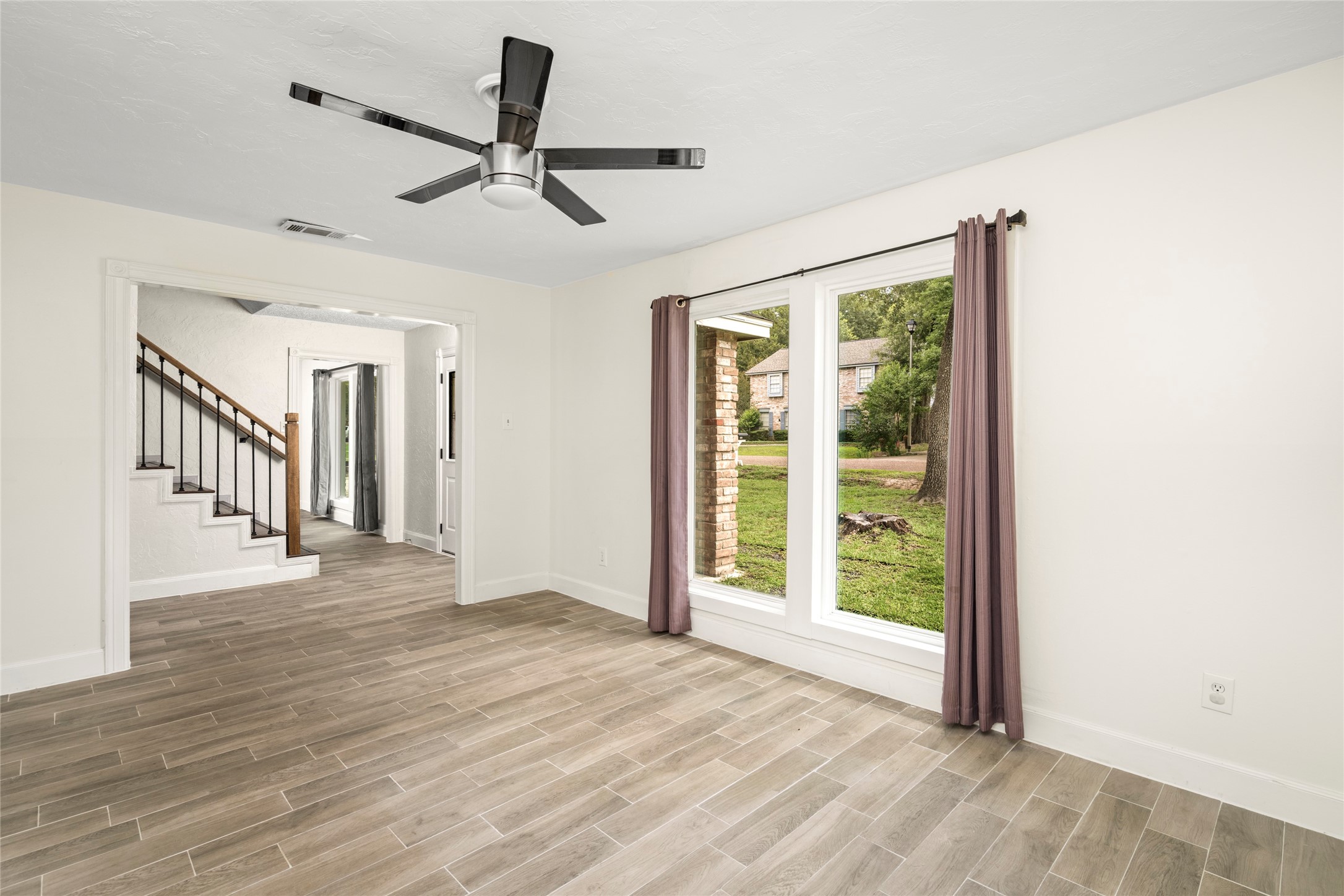 560 Landfall Lane Conroe, TX 77302 - Photo 13 of 41 Secondary view of the formal living room into the foyer.