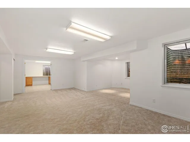 a view of empty room with windows