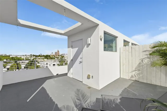 a view of a floor to ceiling window and an outdoor space