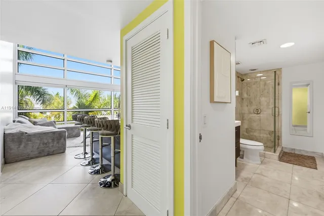 a bathroom with a tub shower and sink