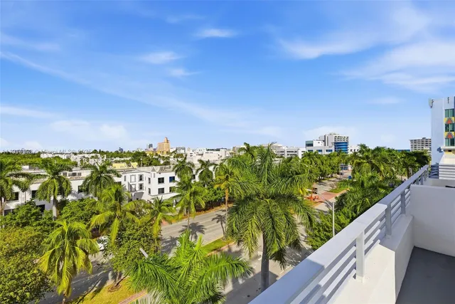 a view of a garden with lawn chairs