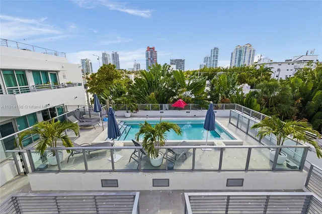 a view of a chairs and table in a patio