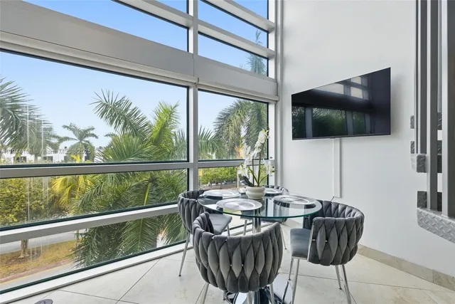 a view of a living room with furniture window and outside view