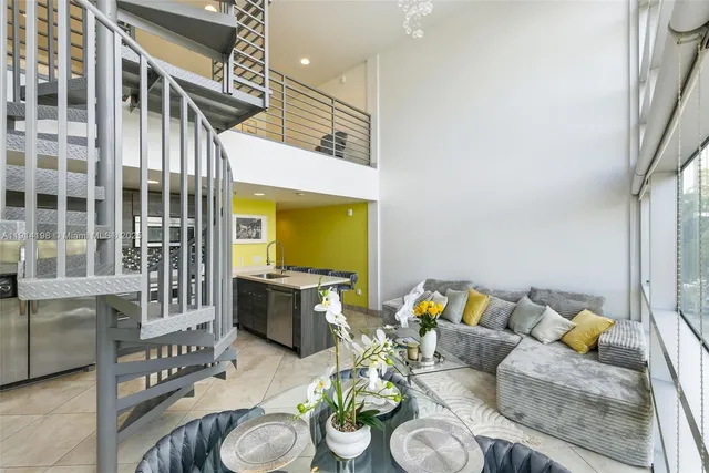 a living room with furniture and a rug