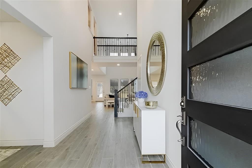 a view of living room with wooden floor and furniture