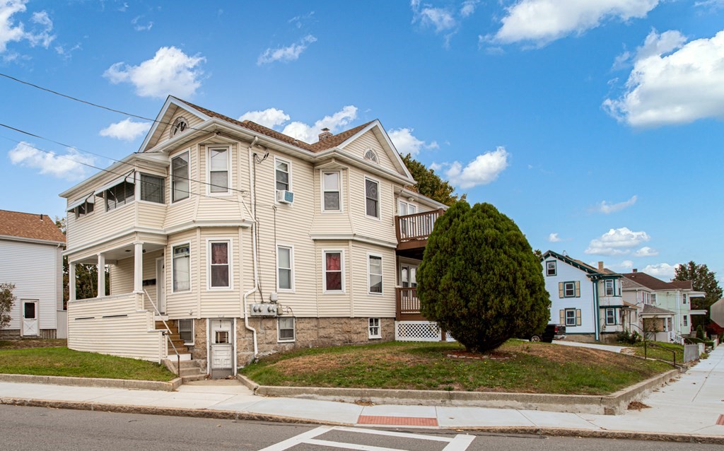 828-830 Stafford Road Fall River, MA 02721 - Photo 3 of 30 a front view of a house with garden