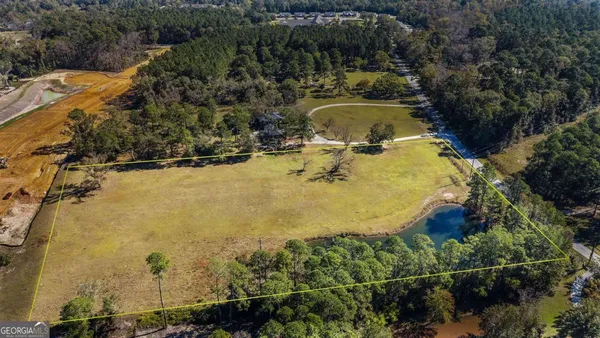 a view of a swimming pool with a yard