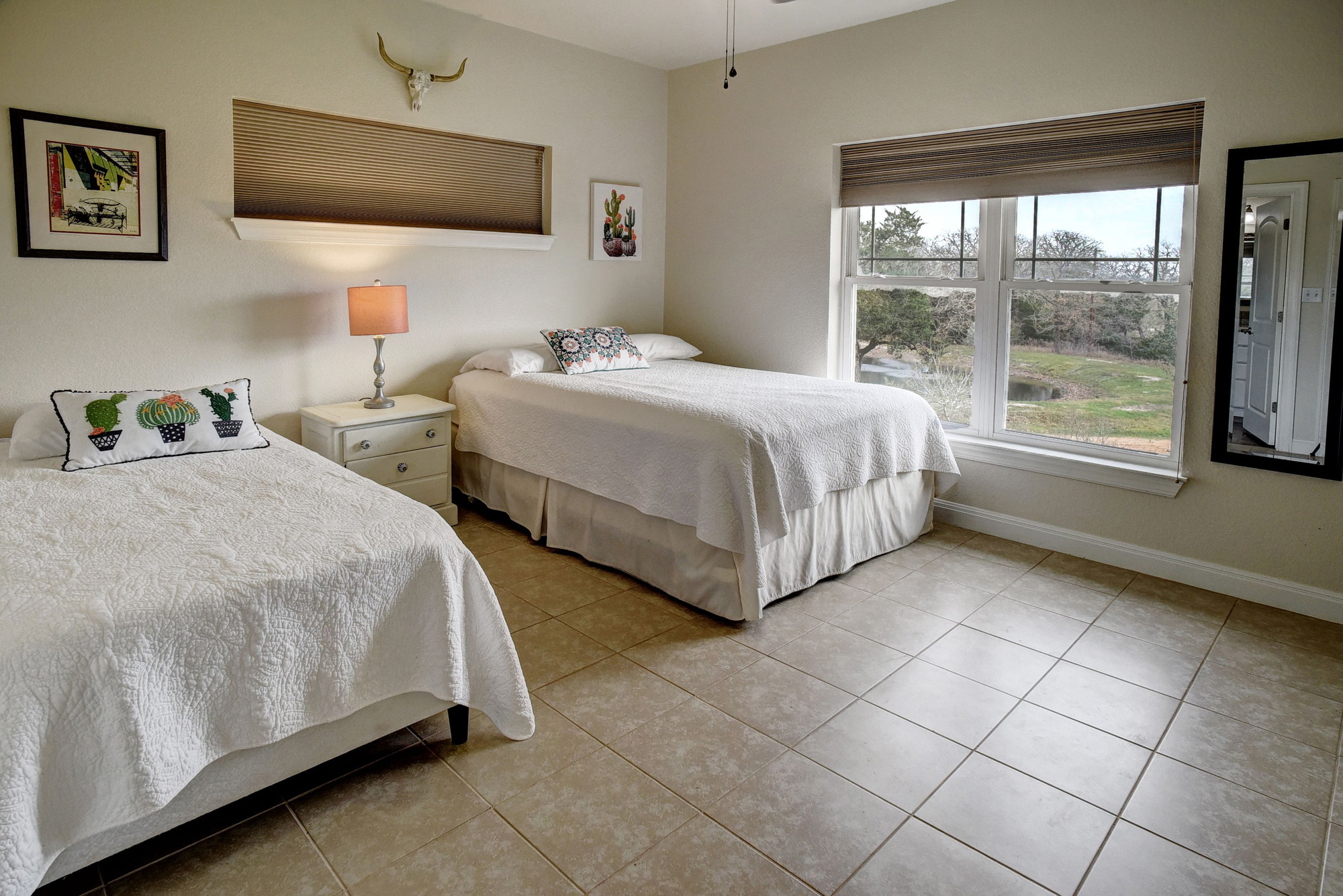 418 Vyvjala Road Smithville, TX 78957 - Photo 24 of 40 Bedroom featuring light tile patterned floors and baseboards