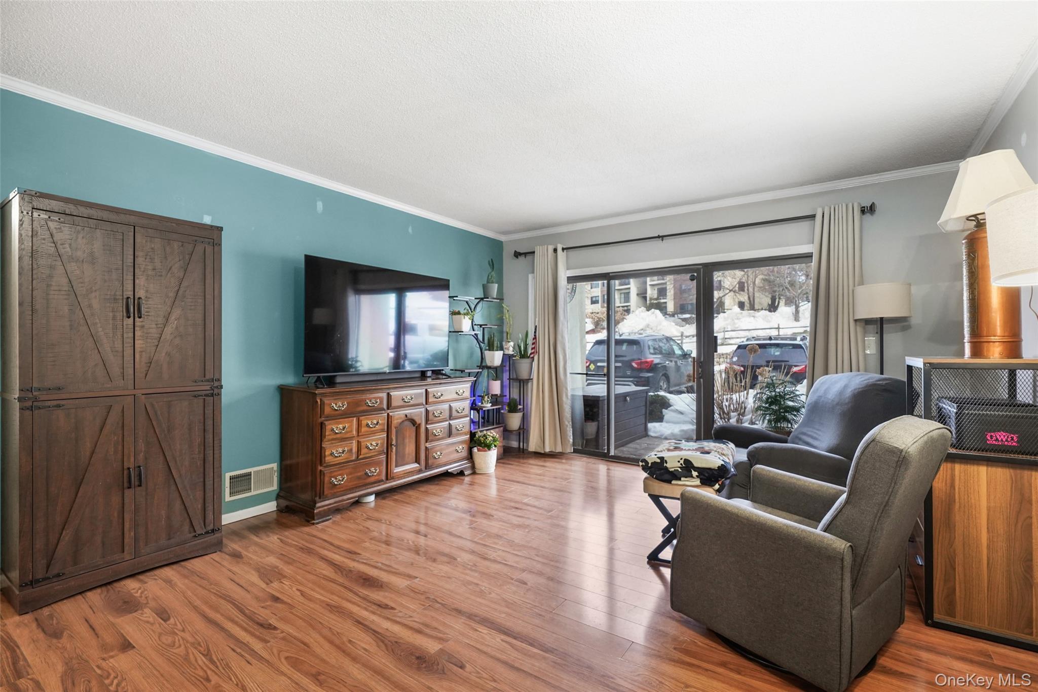 4 Notingham Circle Peekskill, NY 10566 - Photo 3 of 17 Living room with sliding glass doors to the patio