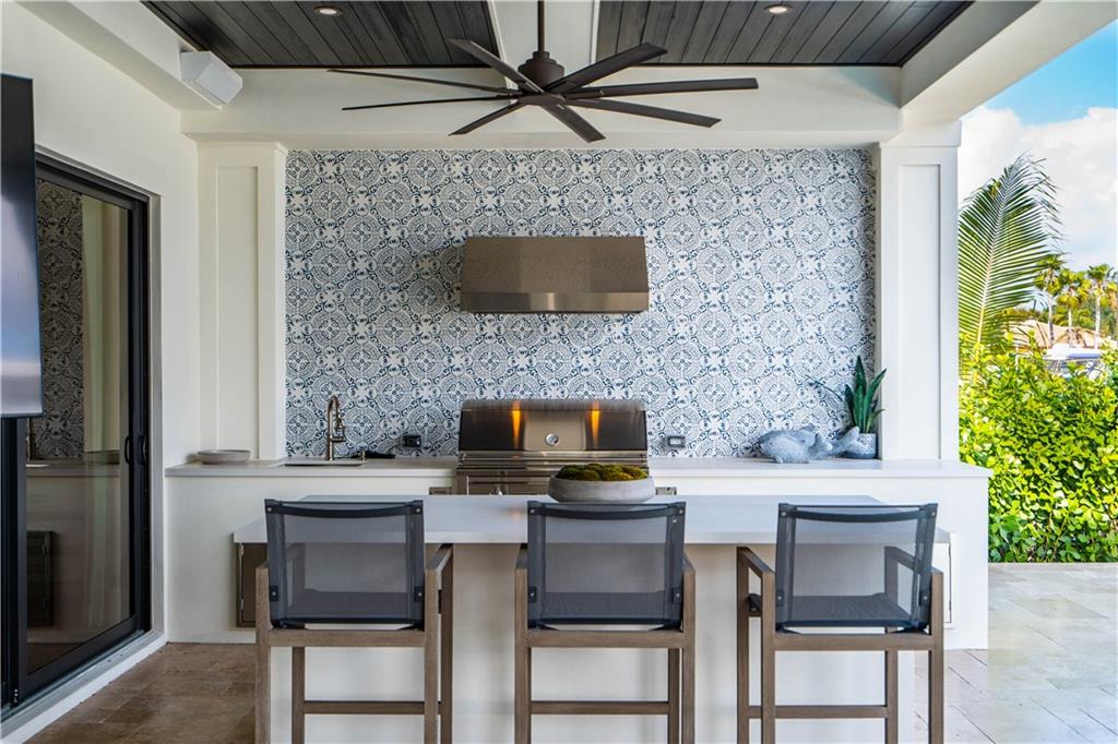 2349 Northeast 24th Street Lighthouse Point, FL 33064 - Photo 26 of 85 a kitchen with a sink cabinets and a counter top space