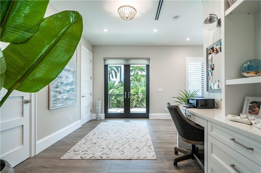 2349 Northeast 24th Street Lighthouse Point, FL 33064 - Photo 30 of 85 a workspace with furniture and window