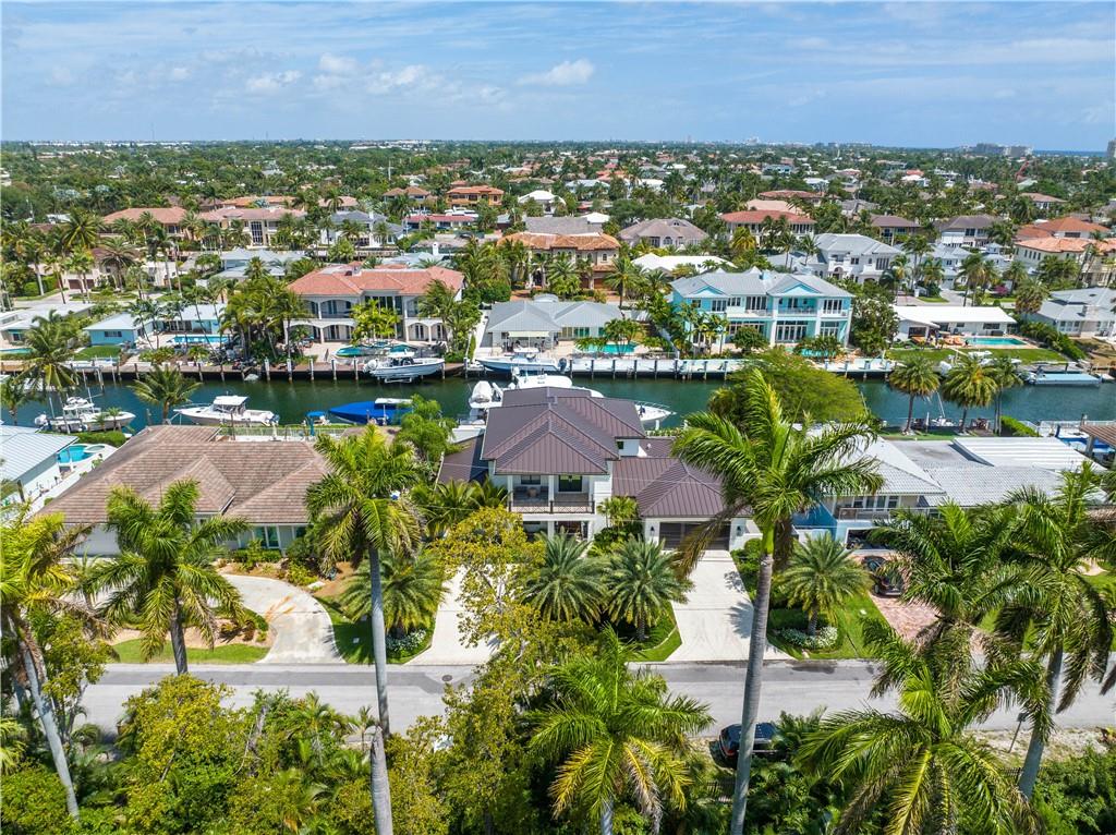 2349 Northeast 24th Street Lighthouse Point, FL 33064 - Photo 3 of 85 an aerial view of a city with lots of residential buildings ocean and mountain view in back