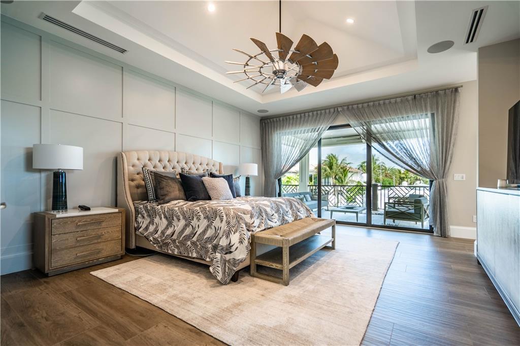 2349 Northeast 24th Street Lighthouse Point, FL 33064 - Photo 32 of 85 a bed room with a bed and a large window