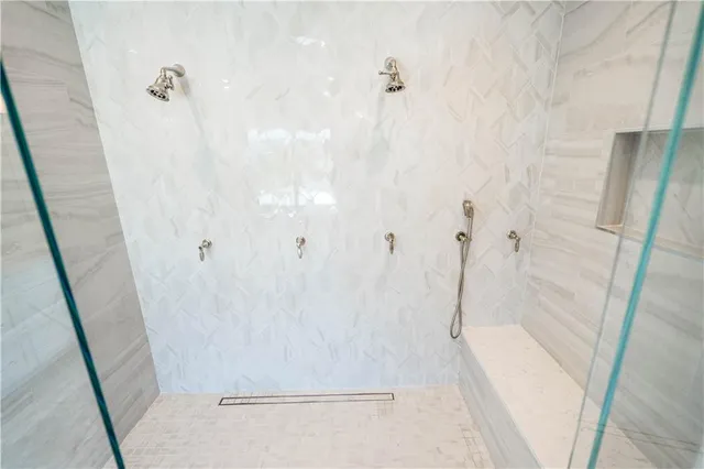 a view of a house with swimming pool and sitting area