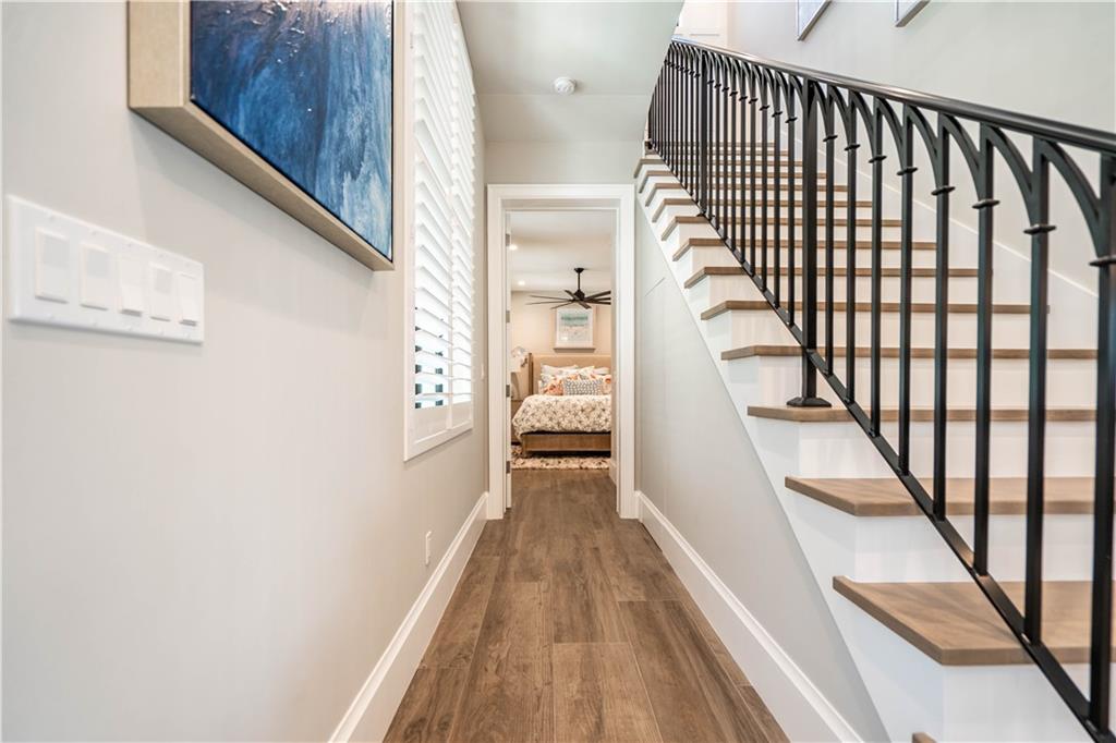 2349 Northeast 24th Street Lighthouse Point, FL 33064 - Photo 55 of 85 a view of a hallway with wooden floor and staircase