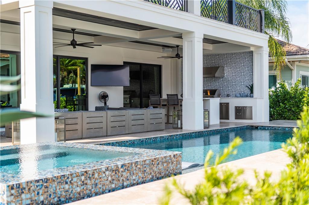 2349 Northeast 24th Street Lighthouse Point, FL 33064 - Photo 69 of 85 a view of a house with a swimming pool