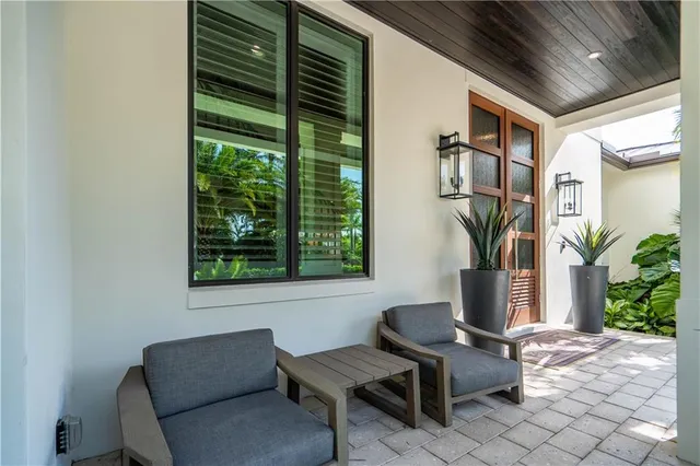 a large kitchen with a table and chairs