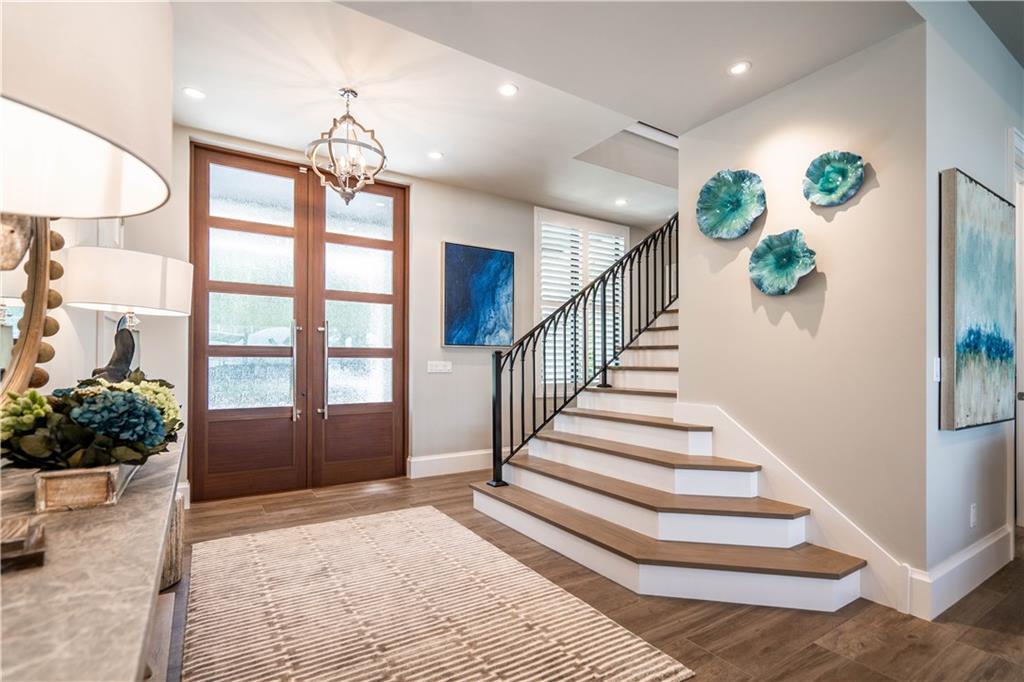 2349 Northeast 24th Street Lighthouse Point, FL 33064 - Photo 10 of 85 a view of entryway and hall with wooden floor
