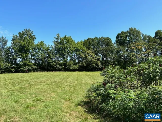 a view of outdoor space with deck and yard