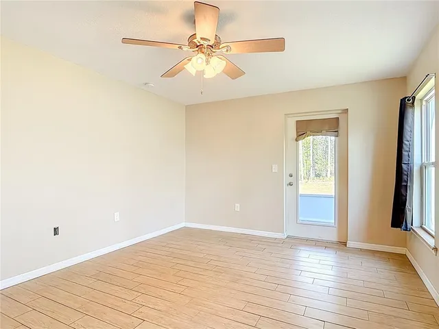 a view of a livingroom with a chandelier fan