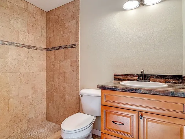 a view of a livingroom with a ceiling fan and window