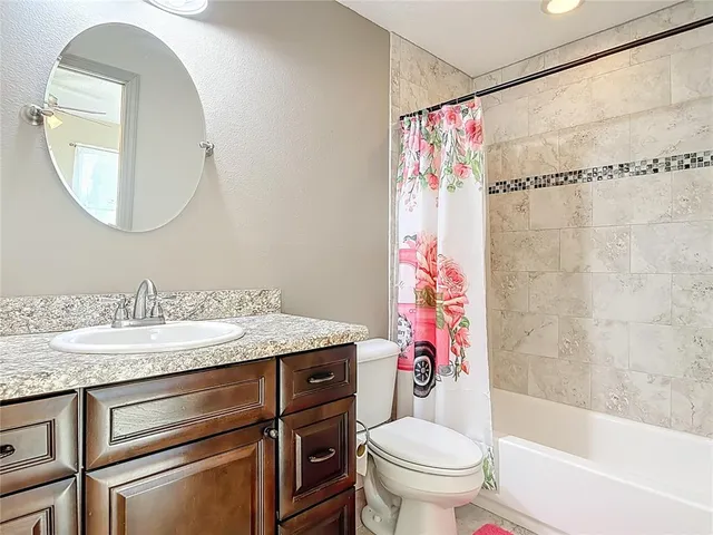 a view of a swimming pool with a patio