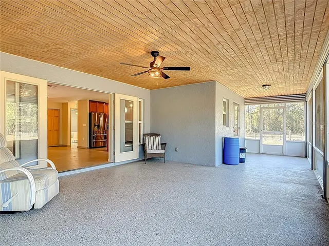 a view of a swimming pool with a patio