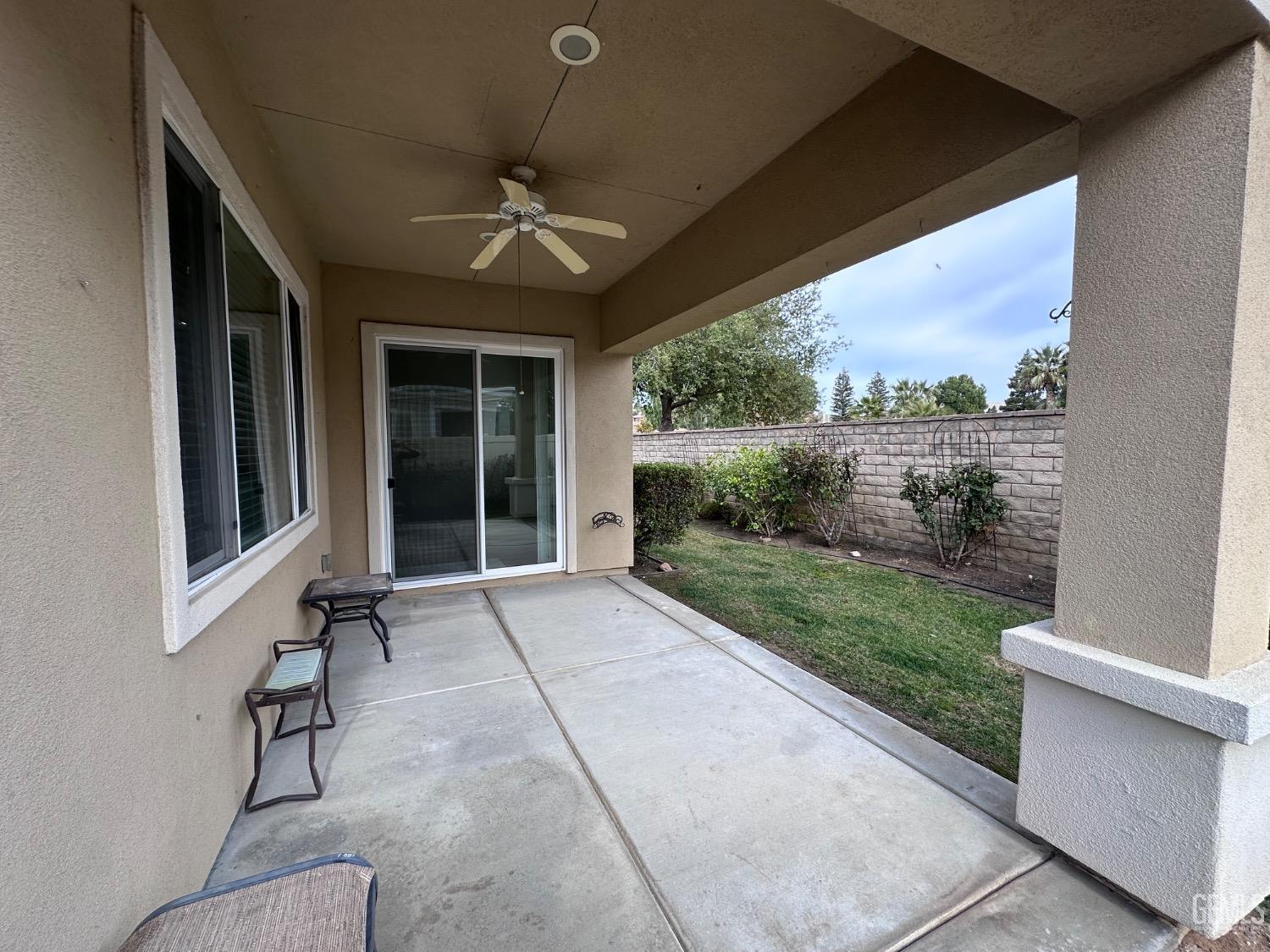 Undisclosed Address Bakersfield, CA 93306 - Photo 11 of 43 a view of a porch with furniture and a yard