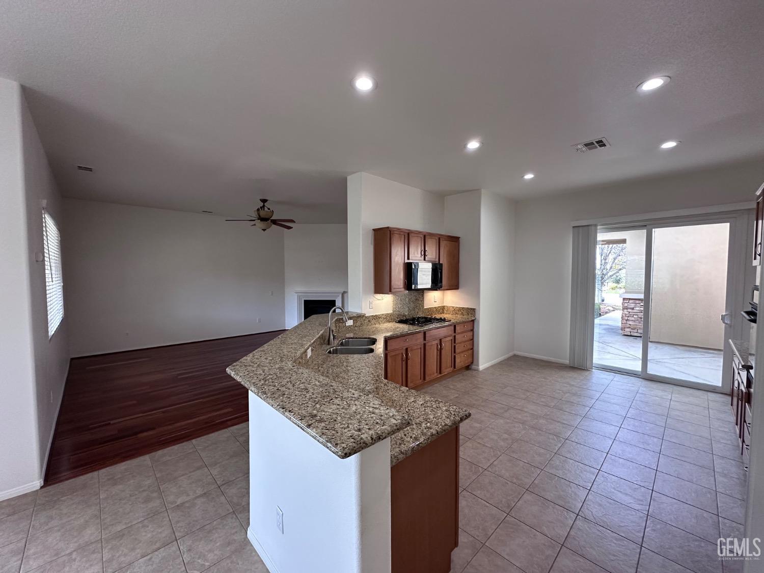 Undisclosed Address Bakersfield, CA 93306 - Photo 16 of 43 a kitchen with kitchen island granite countertop lots of counter top space