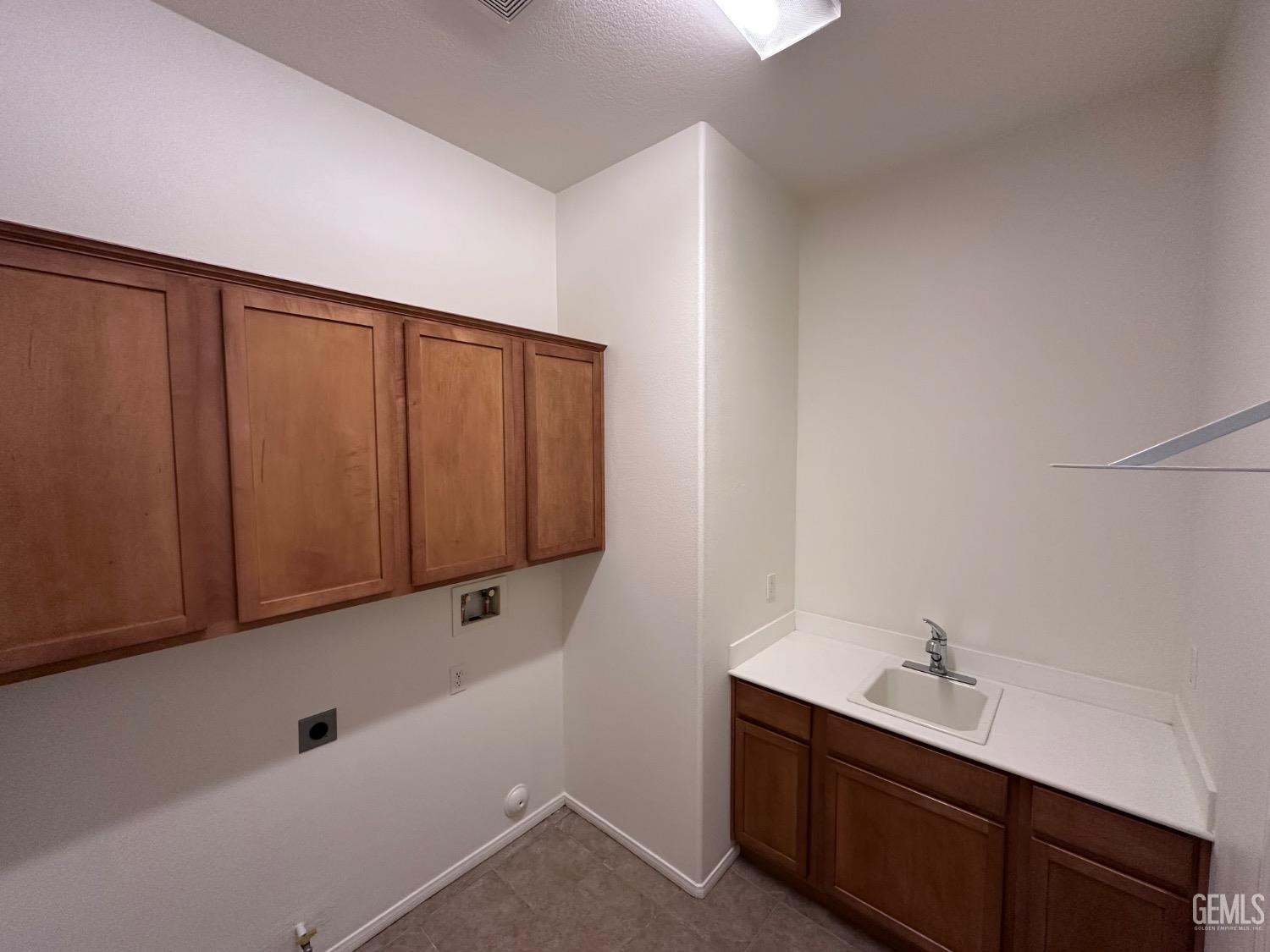 Undisclosed Address Bakersfield, CA 93306 - Photo 23 of 43 a bathroom with a sink and mirror
