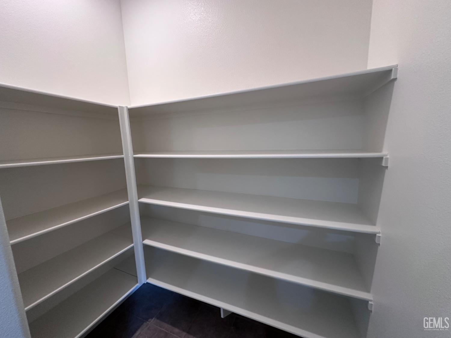 Undisclosed Address Bakersfield, CA 93306 - Photo 24 of 43 a view of walk in closet with empty racks