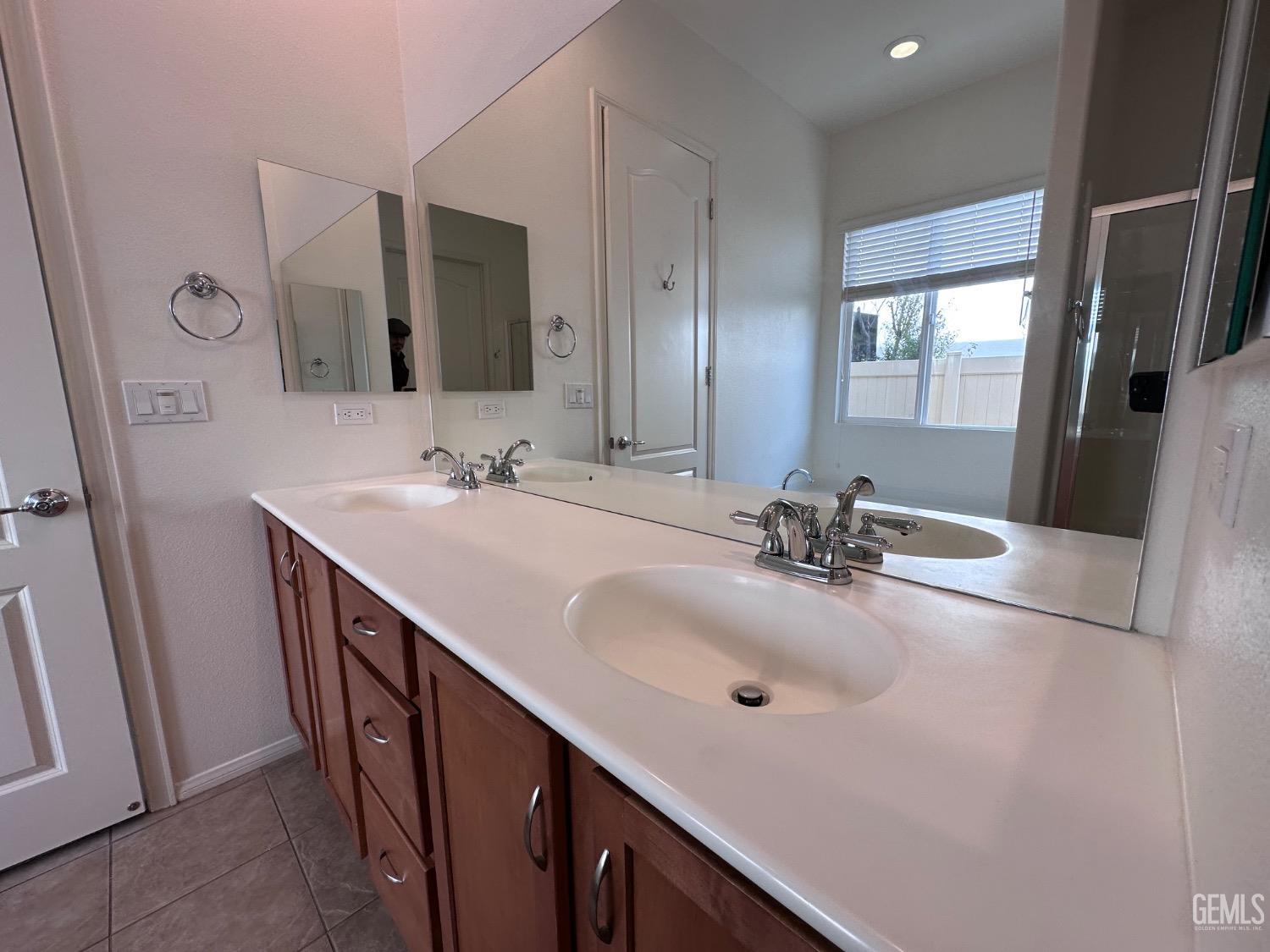 Undisclosed Address Bakersfield, CA 93306 - Photo 41 of 43 a bathroom with a sink and a mirror