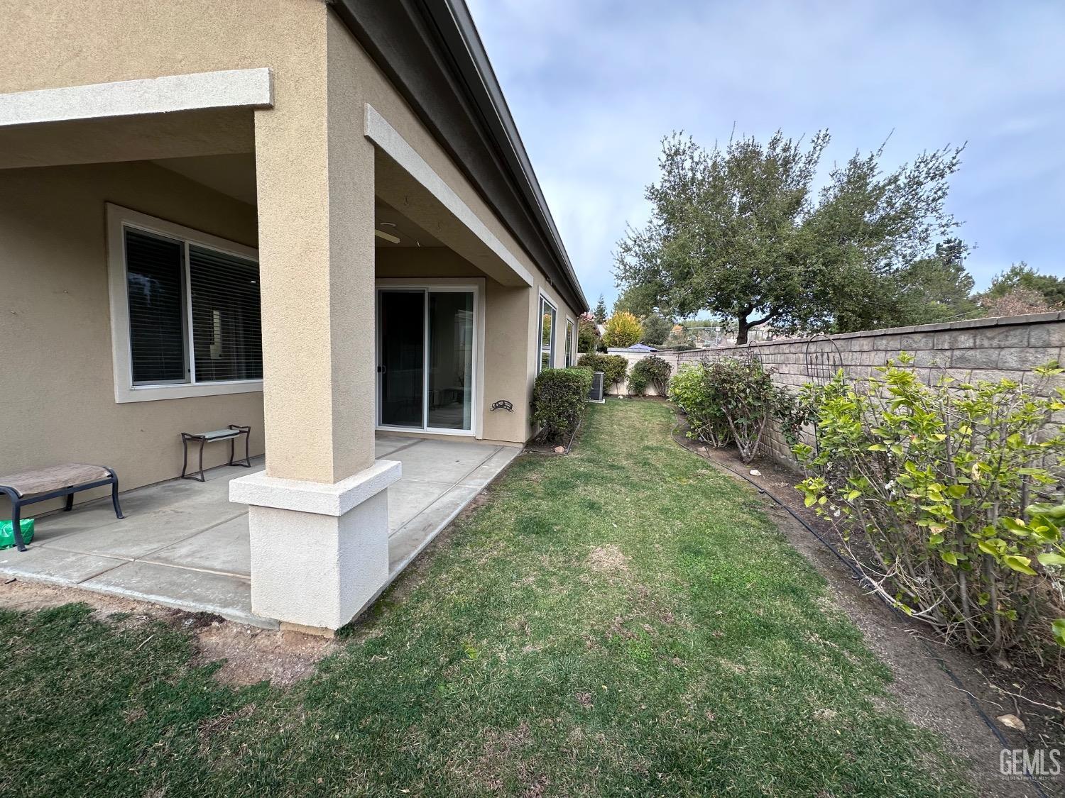 Undisclosed Address Bakersfield, CA 93306 - Photo 7 of 43 a view of house with backyard and garden