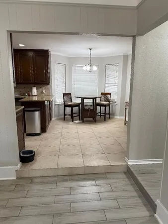 a view of living room with furniture and flat screen tv
