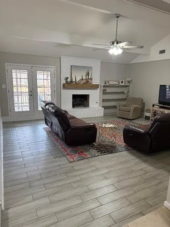 a living room with furniture and a fireplace