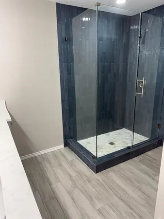 a bathroom with a double vanity sink and mirror