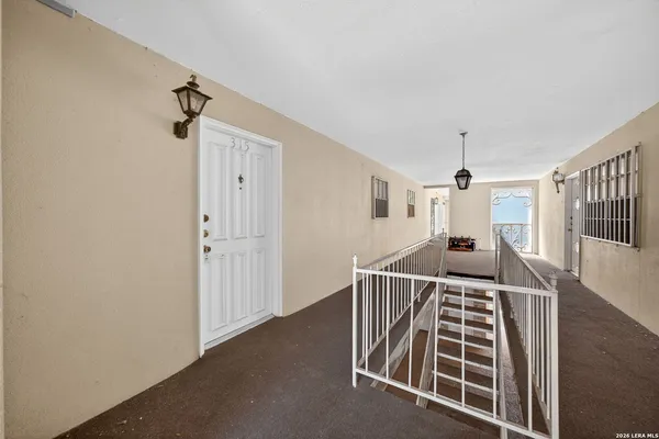 a view of an entryway with wooden floor