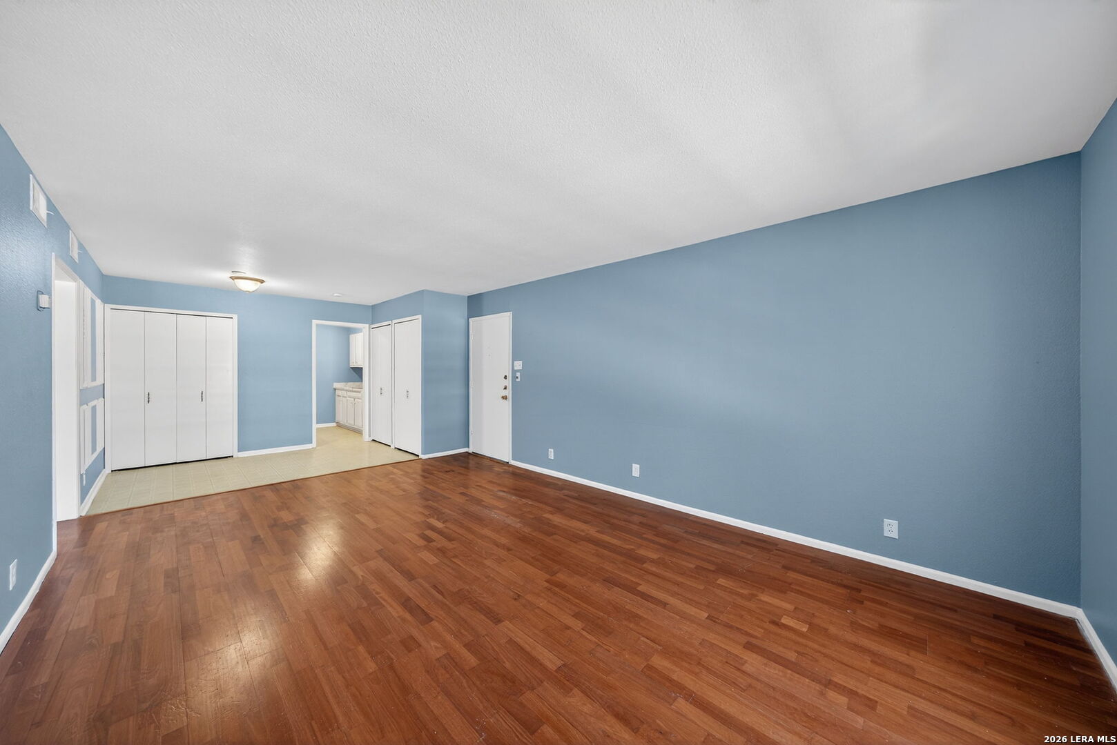 6718 Callaghan Road, Unit 315 San Antonio, TX 78229 - Photo 6 of 27 a view of empty room with wooden floor