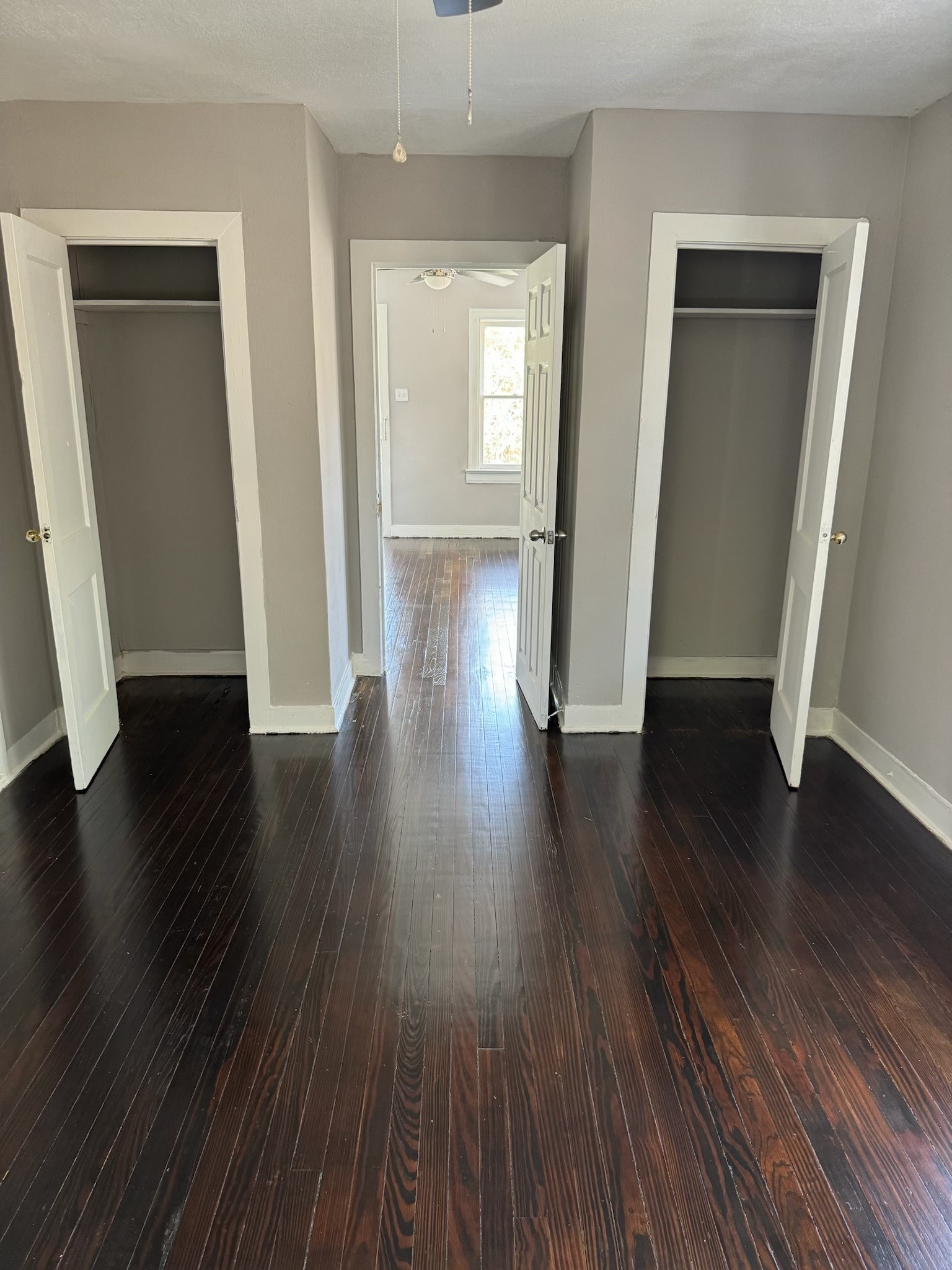 136 1/2 Glendale Street Houston, TX 77012 - Photo 3 of 8 an empty room with wooden floor and windows