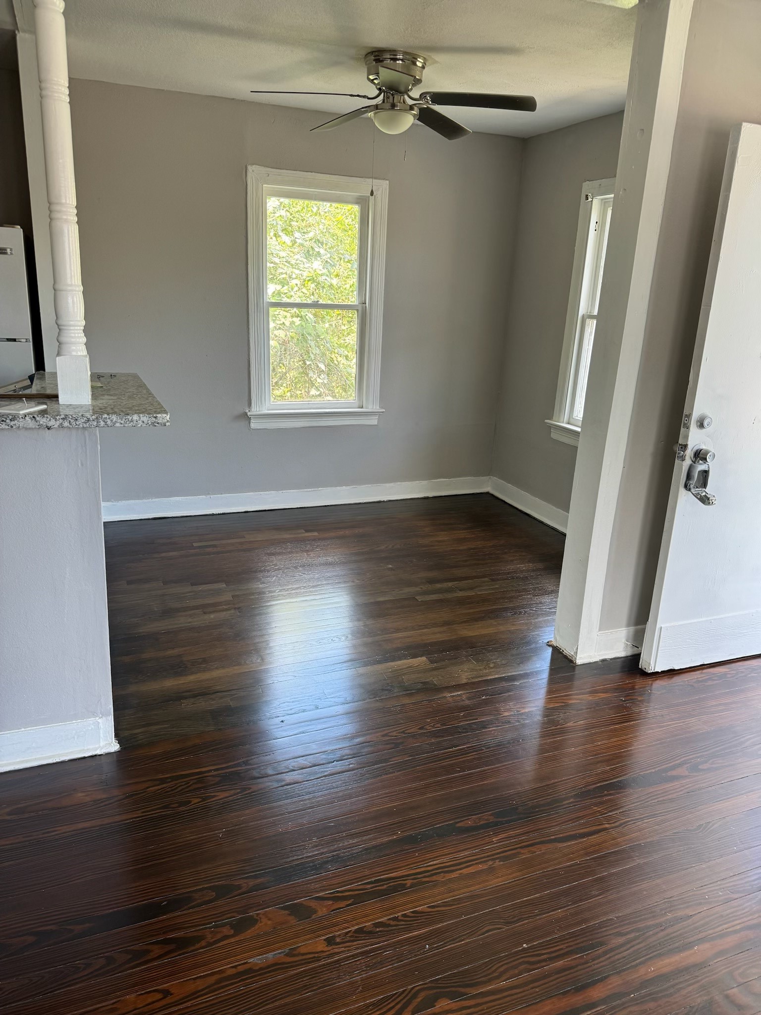 136 1/2 Glendale Street Houston, TX 77012 - Photo 5 of 8 a view of an empty room with wooden floor and a window
