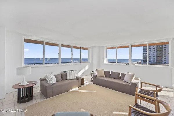 a living room with furniture and a rug