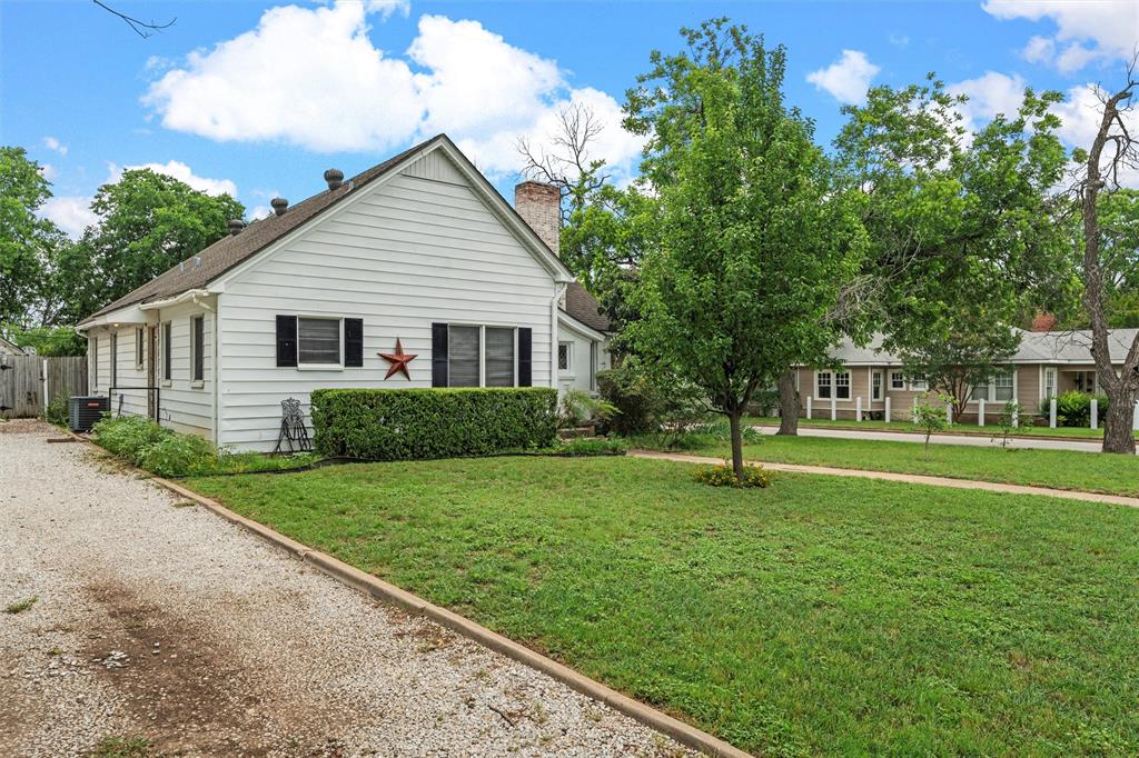 2530 Colcord Avenue Waco, TX 76707 - Photo 2 of 23 View of front facade with a chimney and central AC