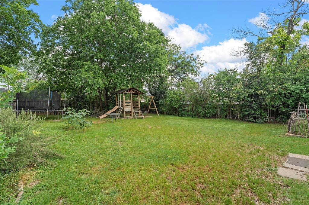 2530 Colcord Avenue Waco, TX 76707 - Photo 22 of 23 View of yard featuring a trampoline and a playground
