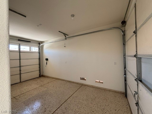 2866 Shimmering Bay Street Laughlin, NV 89029 - Photo 4 of 32 Secure parking is provided in this ample garage, complete with a durable epoxy floor.