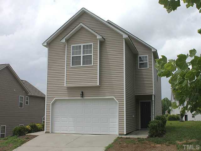 678 Citrus Petal Road Fuquay-Varina, NC 27526 - Photo 1 of 14 a front view of a house with a garage