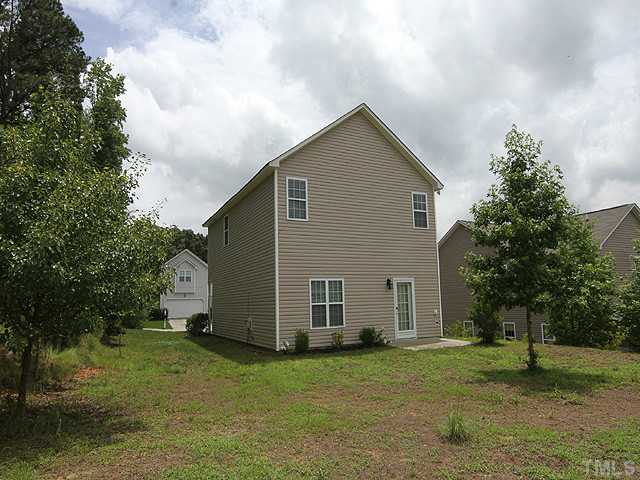 678 Citrus Petal Road Fuquay-Varina, NC 27526 - Photo 11 of 14 a view of a house with a yard