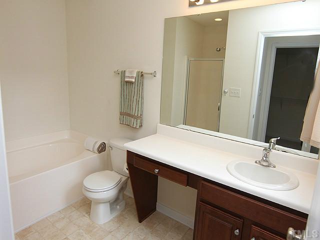 678 Citrus Petal Road Fuquay-Varina, NC 27526 - Photo 6 of 14 a bathroom with a sink toilet and shower